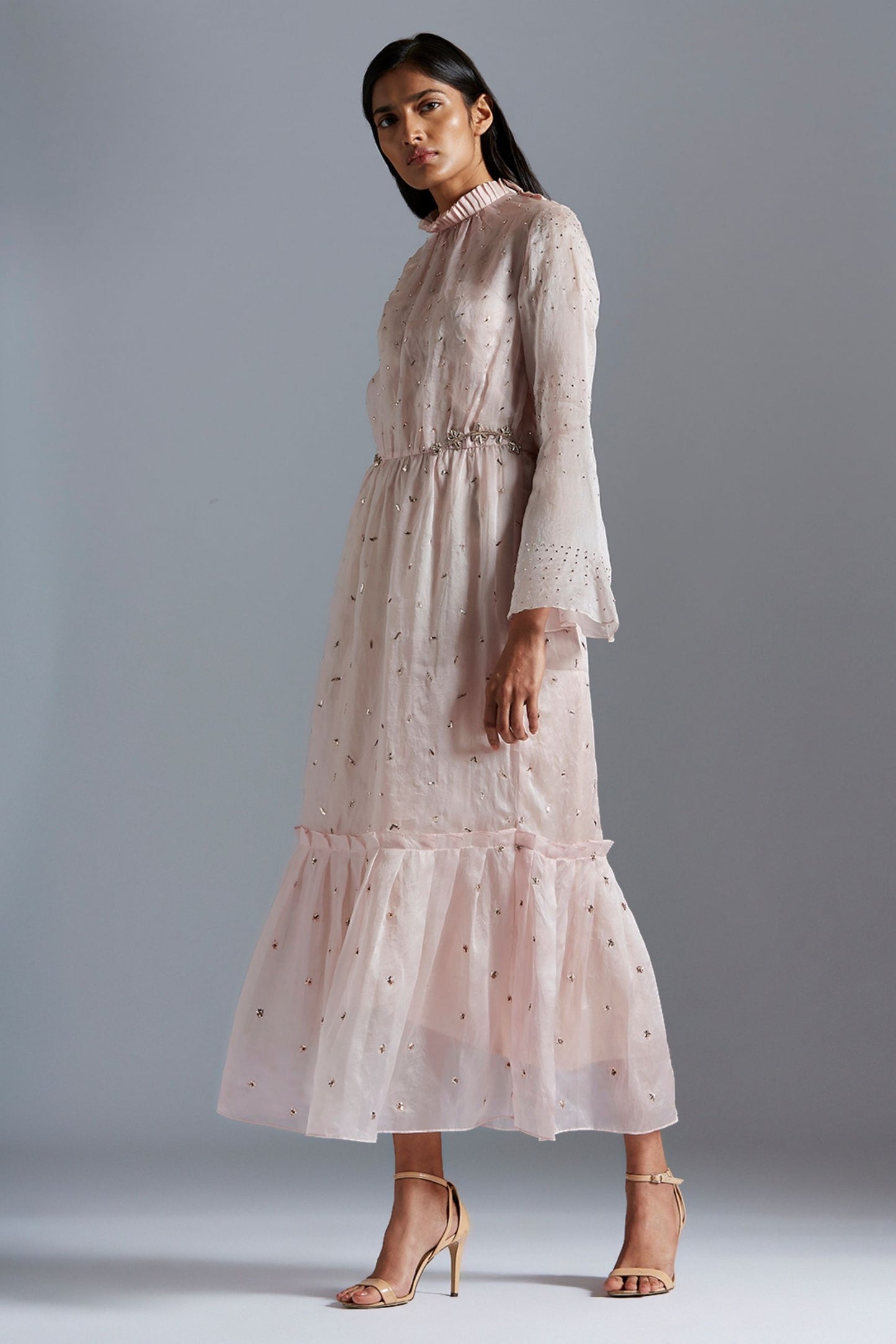 Side view of sheer maxi dress with mukaish work and elegant Victorian sleeves