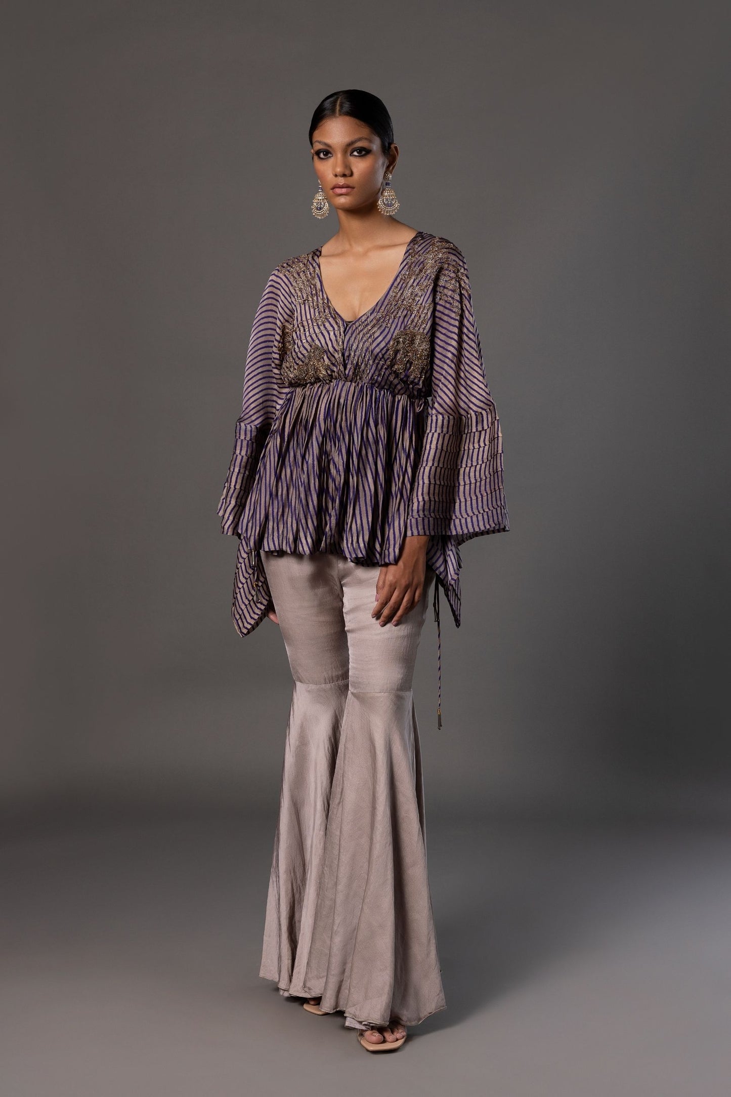 Full view of the Shikhar Baugh Peplum Top with grey gharara pants, highlighting the elegant design and embroidery