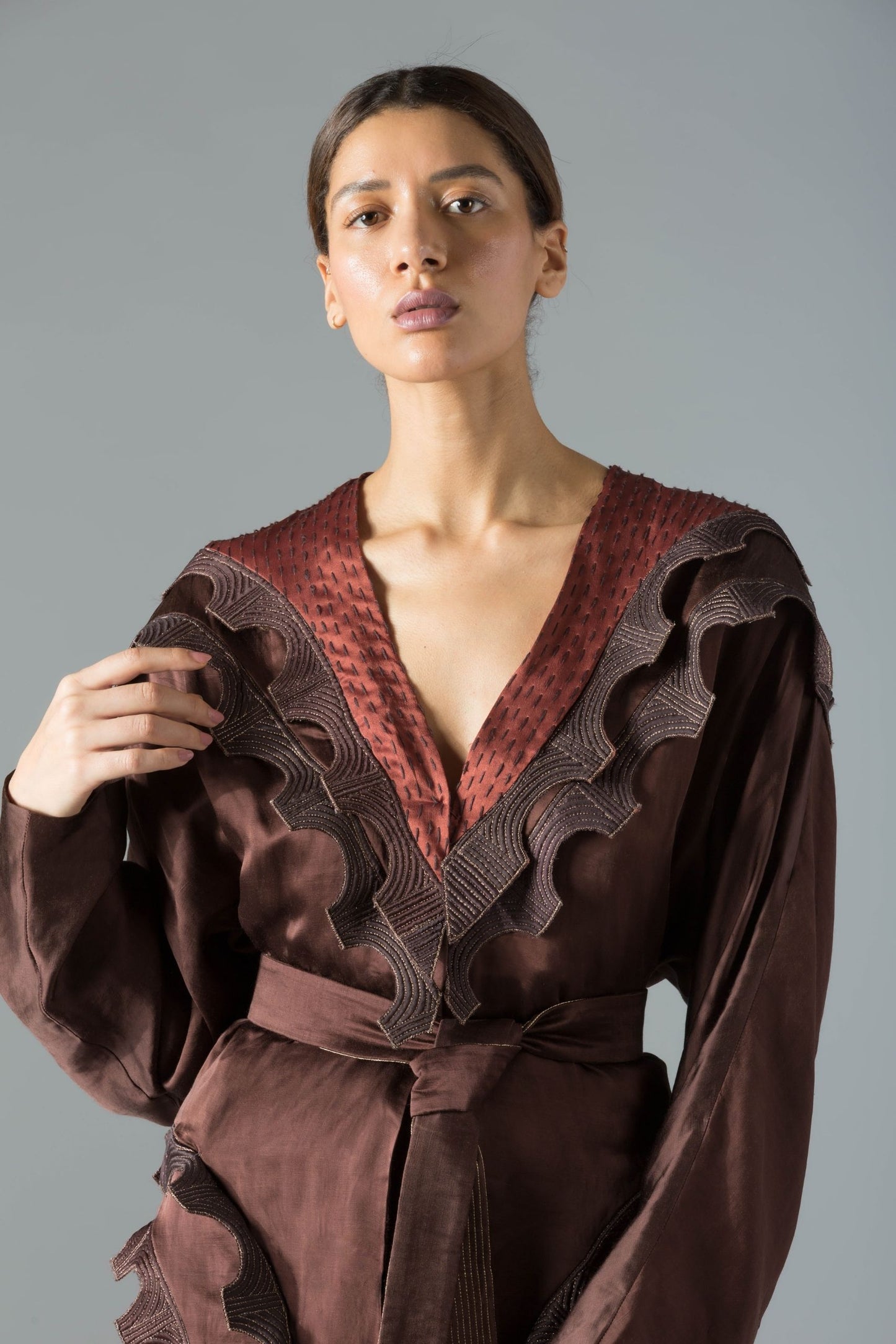 Close-up of the scallop lace details and luxurious satin fabric on the batwing wrap robe for women