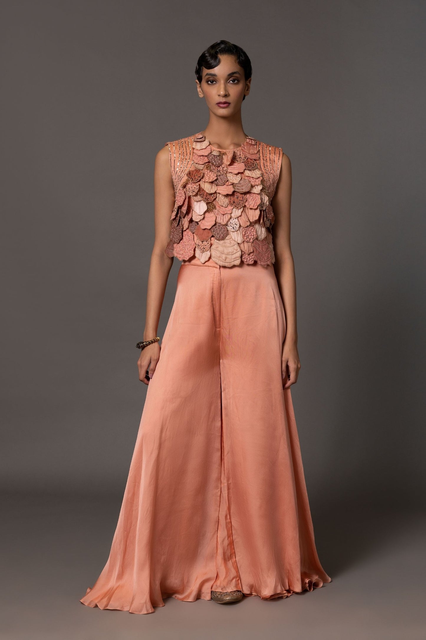 Mima Mounds Pink Blouse with front cutouts, paired with modern flared pants, creating a chic designer blouse and flared pant set for a contemporary look
