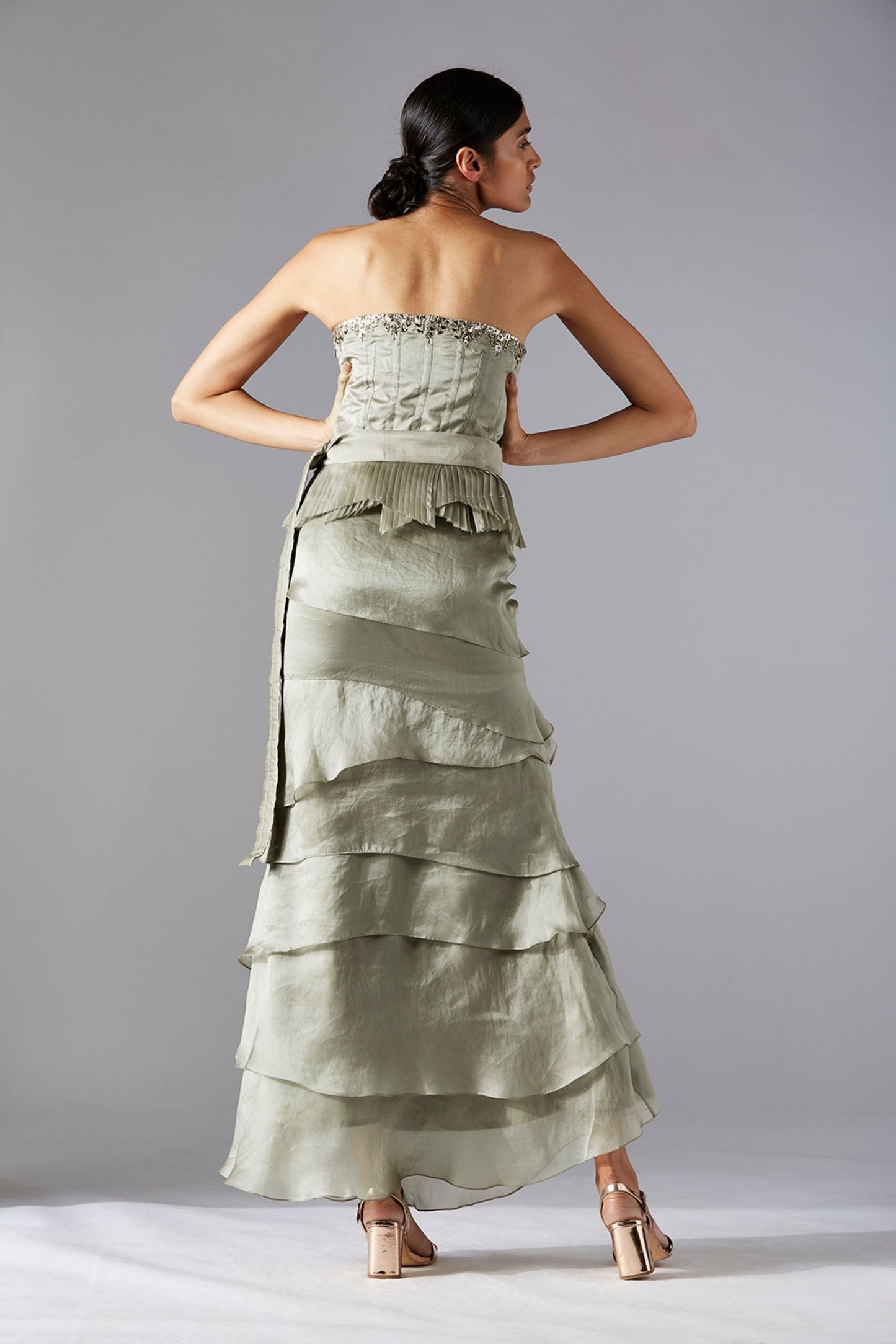 Back view of the corset and skirt set for women, highlighting the elegant design and pleated layers