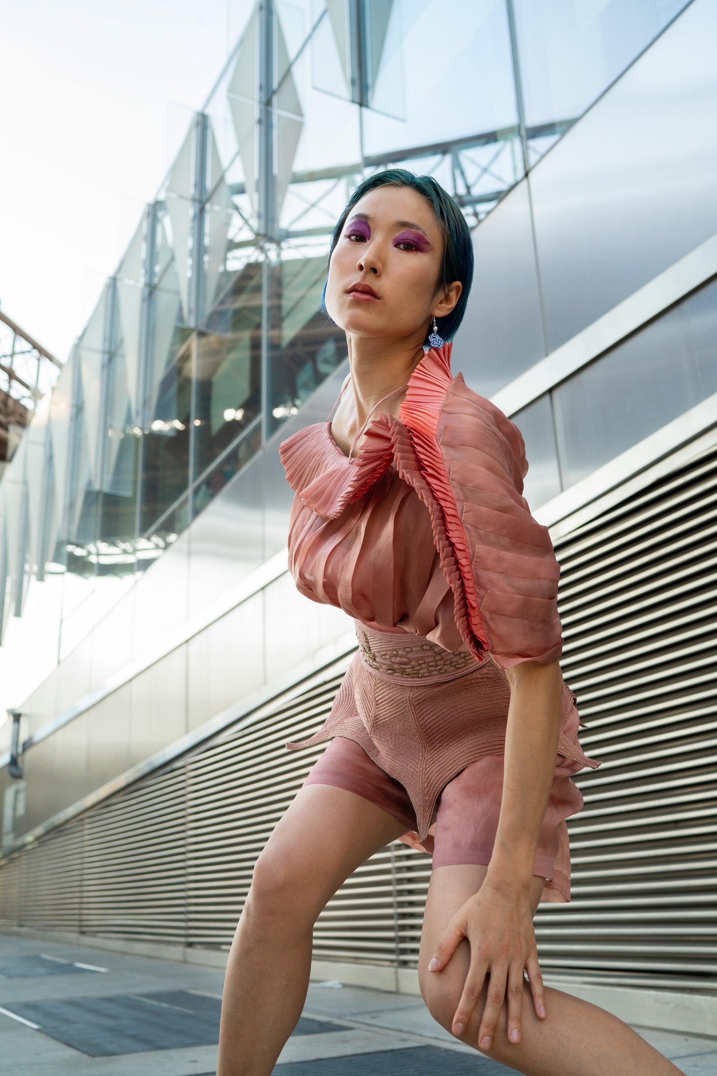 Model wearing the designer mushroom top with handmade pleating and satin organza, exuding a sophisticated and stylish look