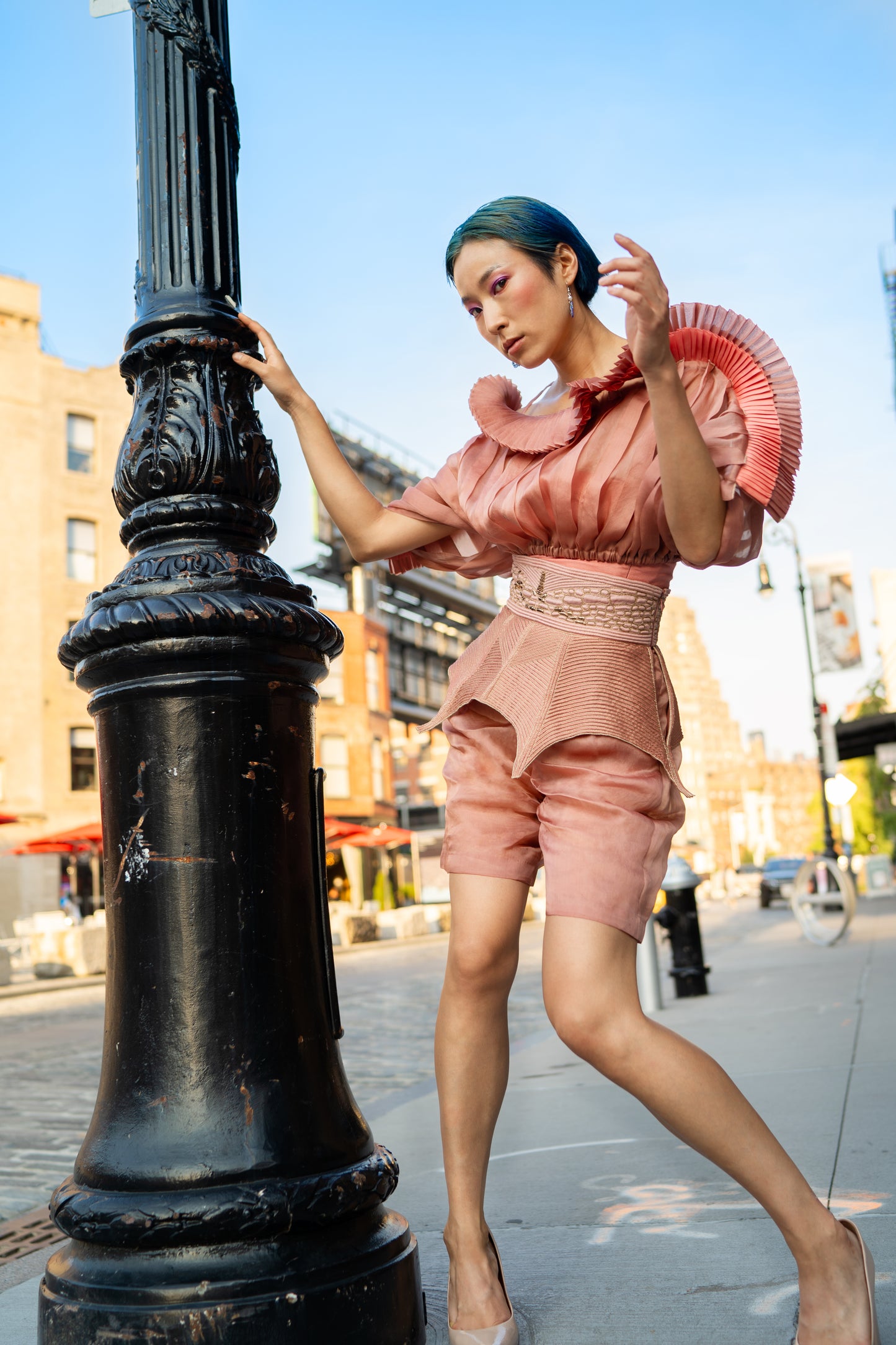 Full view of the designer mushroom top, emphasizing the sleek silhouette and pleated details of the satin organza fabric