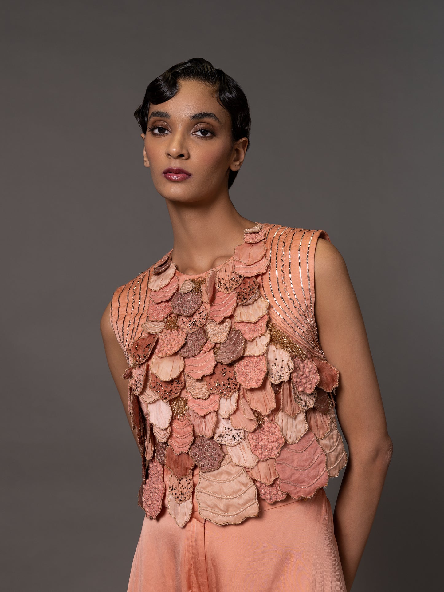 Close-up of the front cutouts on the Mima Mounds Pink Blouse, highlighting the modern and stylish design details