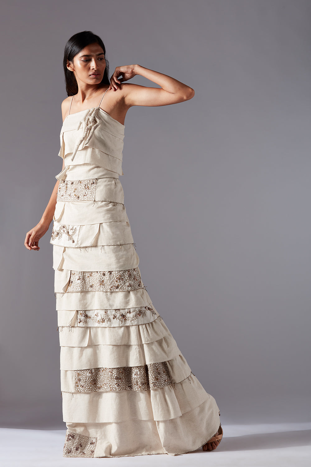 Full view of the designer gown for women with honeycomb handwork, highlighting the modern and elegant silhouette