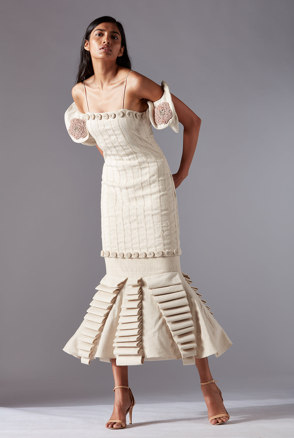 Wood Crust Chimes couture dress in natural khadi with rose details and lamp silhouette, showcasing luxury elegance