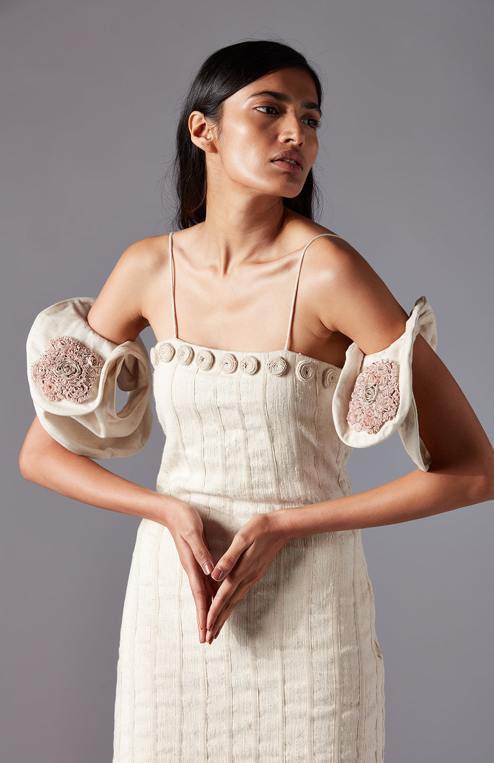 Close-up of the rose details on the Wood Crust Chimes couture dress made from natural khadi