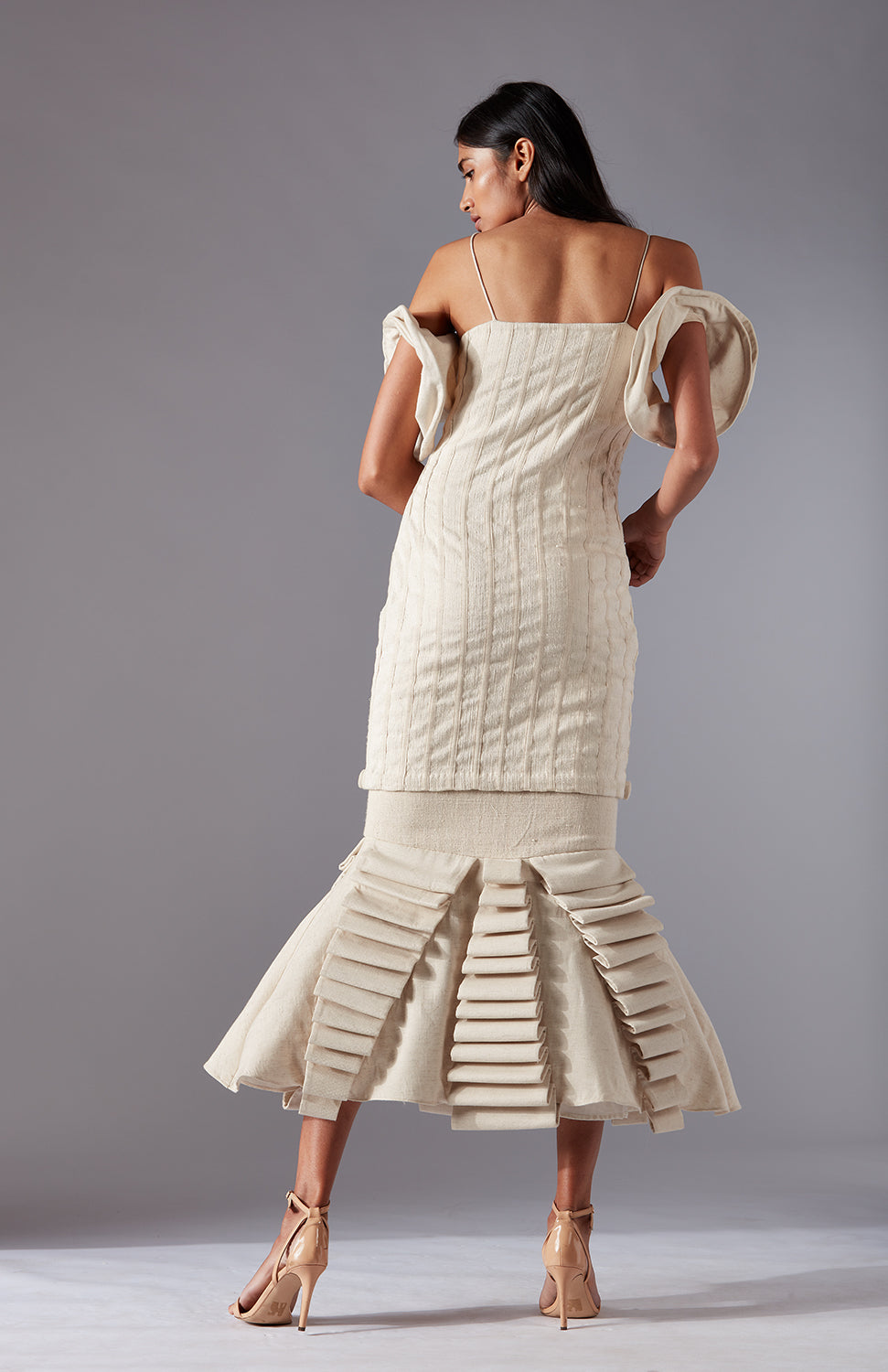 Back view of the Wood Crust Chimes couture dress, highlighting the couture tailoring and rose details