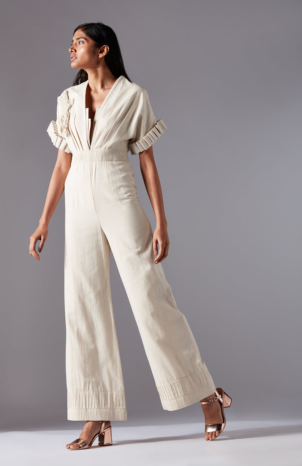 Stylish modern jumpsuit for women in khadi with sculpted sleeves, hummingbird motif, and waist pleating, designed for a chic look
