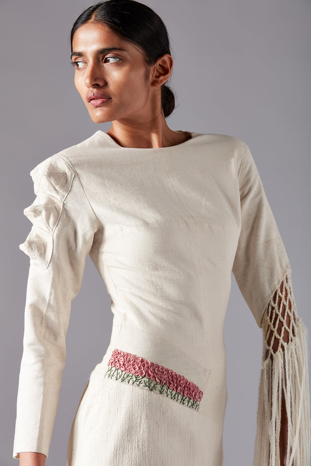 Close-up view of the textured khadi fabric and crochet details on the Collage Crochet Gown