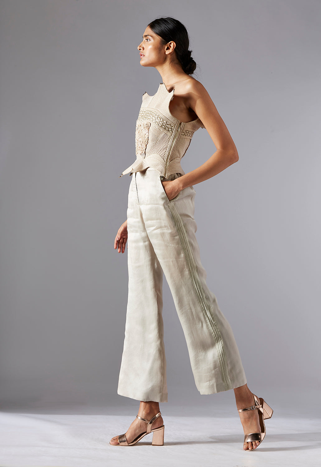 Side profile of the Dune corset top and organza pants set, emphasizing the chic design and flattering fit