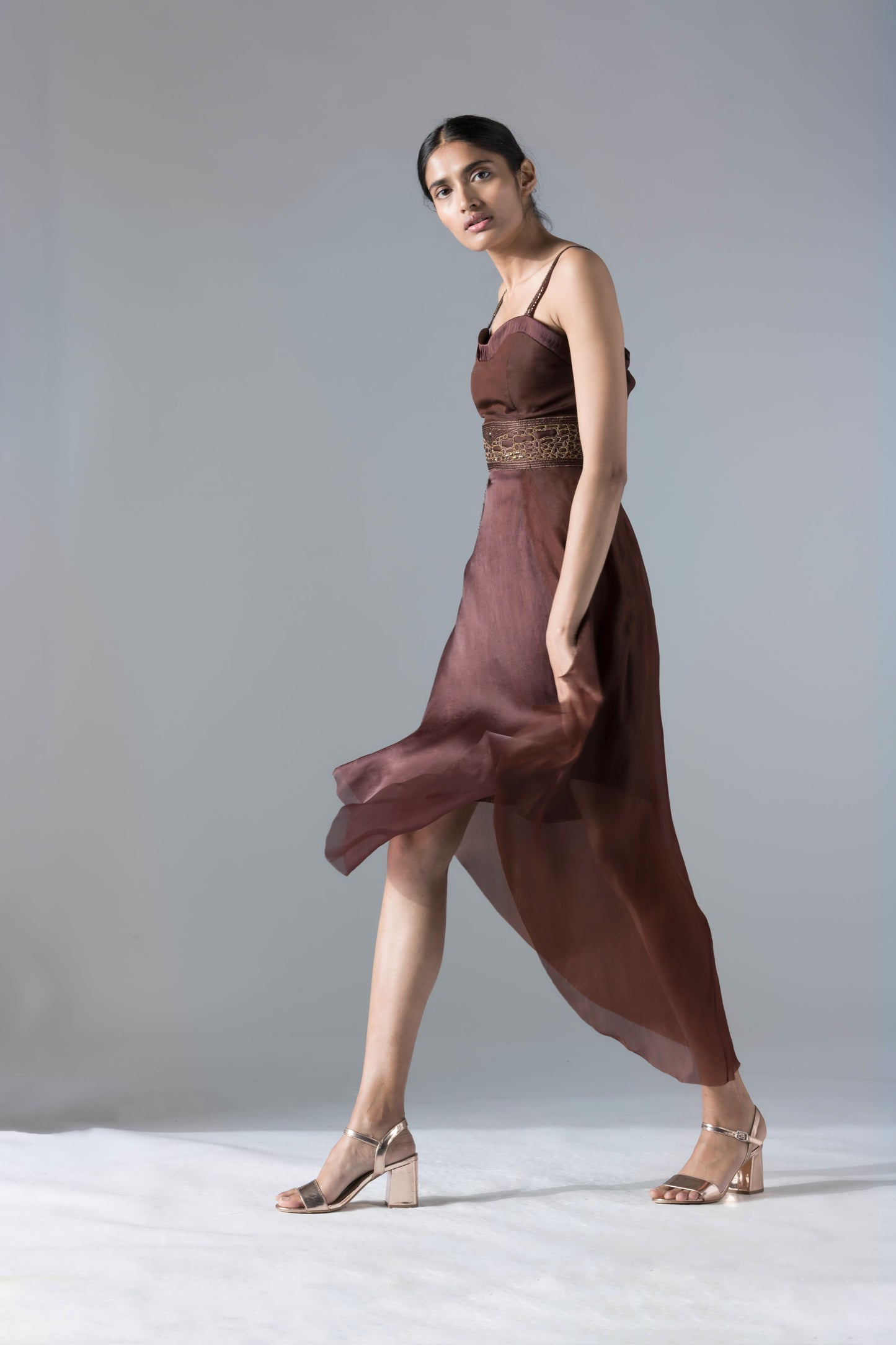Side view of the flared corset tea-length dress, emphasizing the chic fit and design details