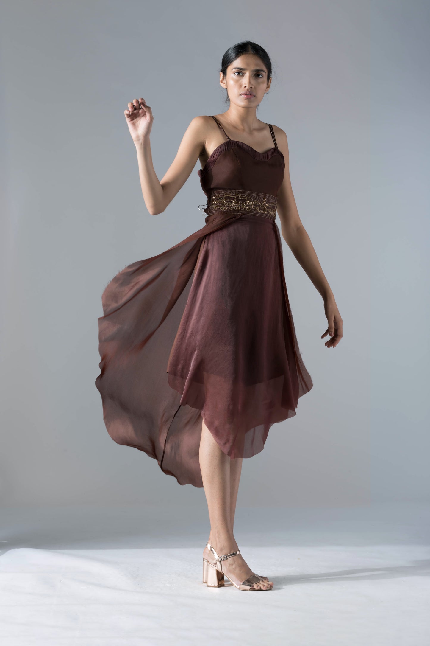 Full view of the luxury designer flared corset tea-length dress, highlighting its elegant silhouette and modern style