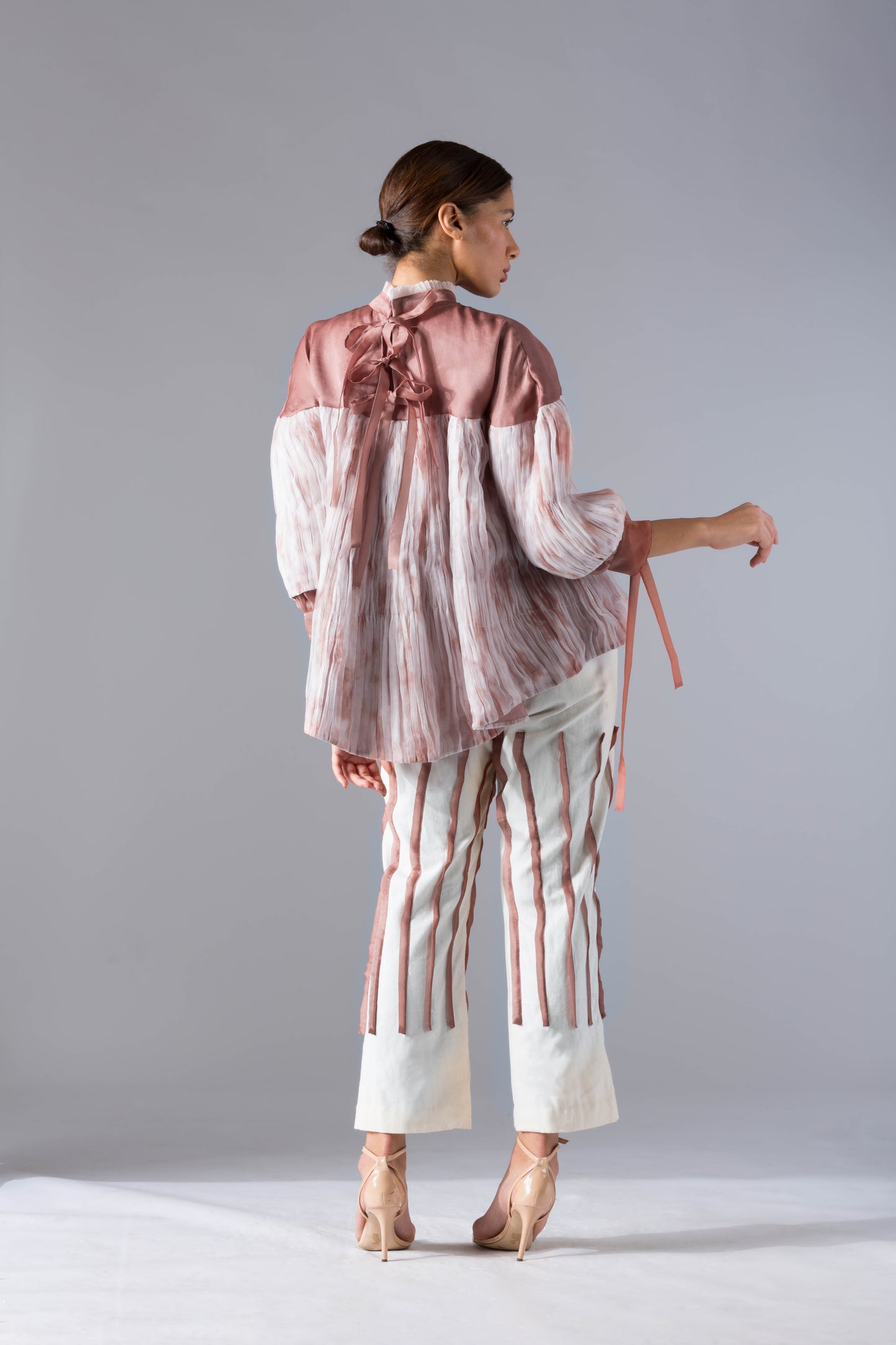Back view of the stylish designer co-ords set, focusing on the clean lines and elegant fit of the batik top and pleated pants