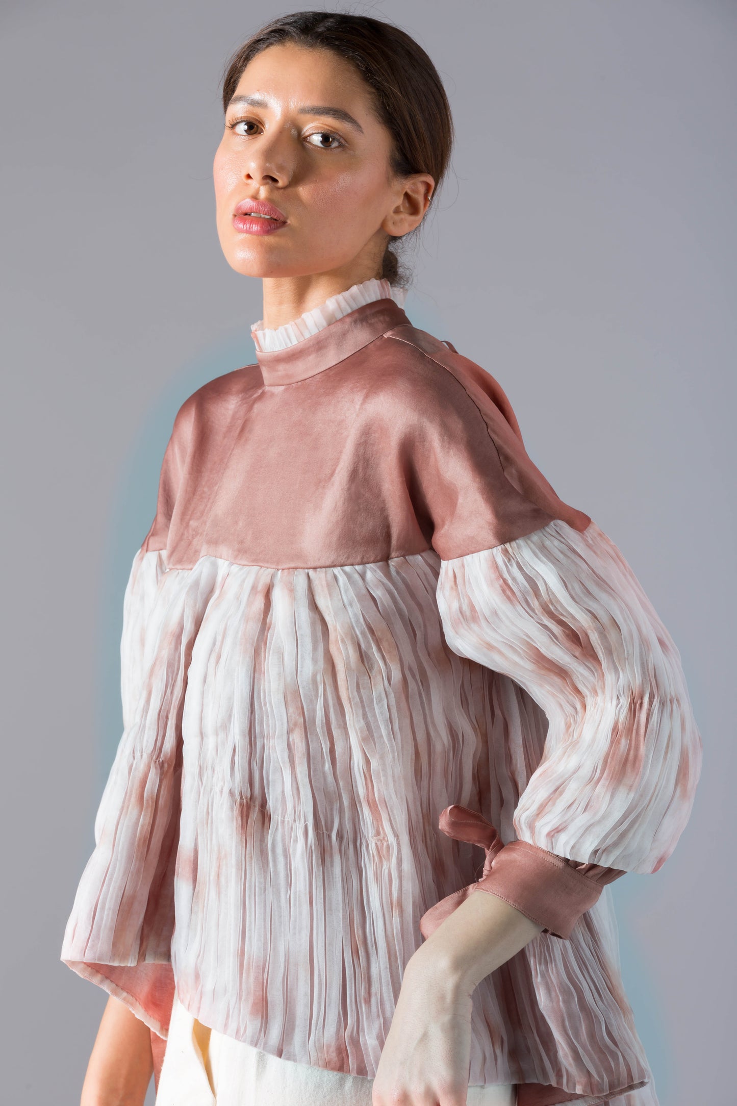 Close-up of the batik print and pleated fabric details on the co-ords set, highlighting the intricate design and texture