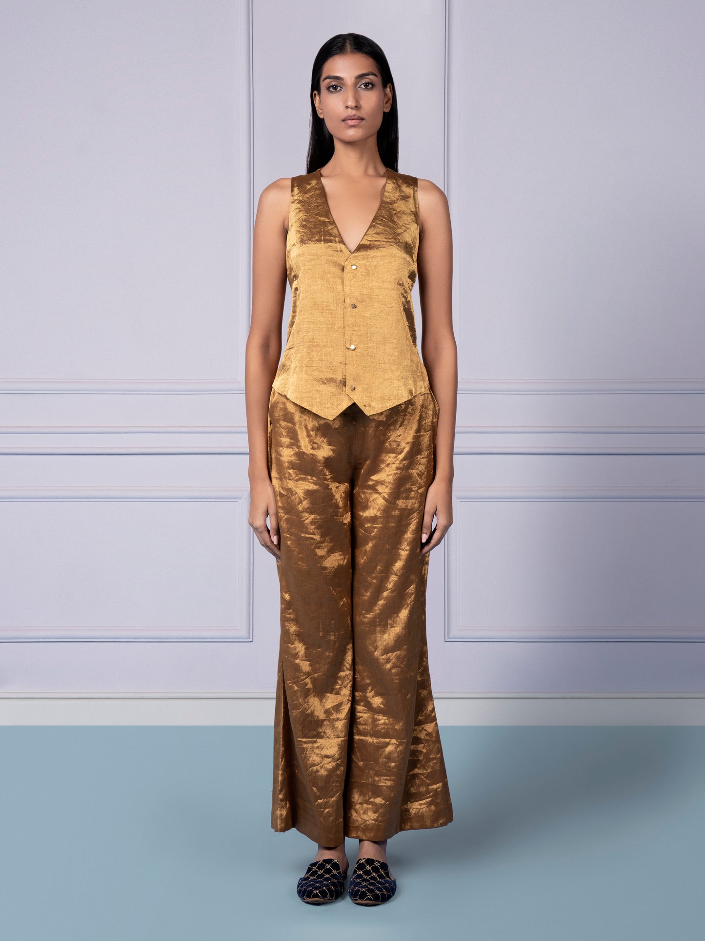 Handwoven Gold Chanderi designer waistcoat paired with flared luxury pants for women, offering a modern and stylish look