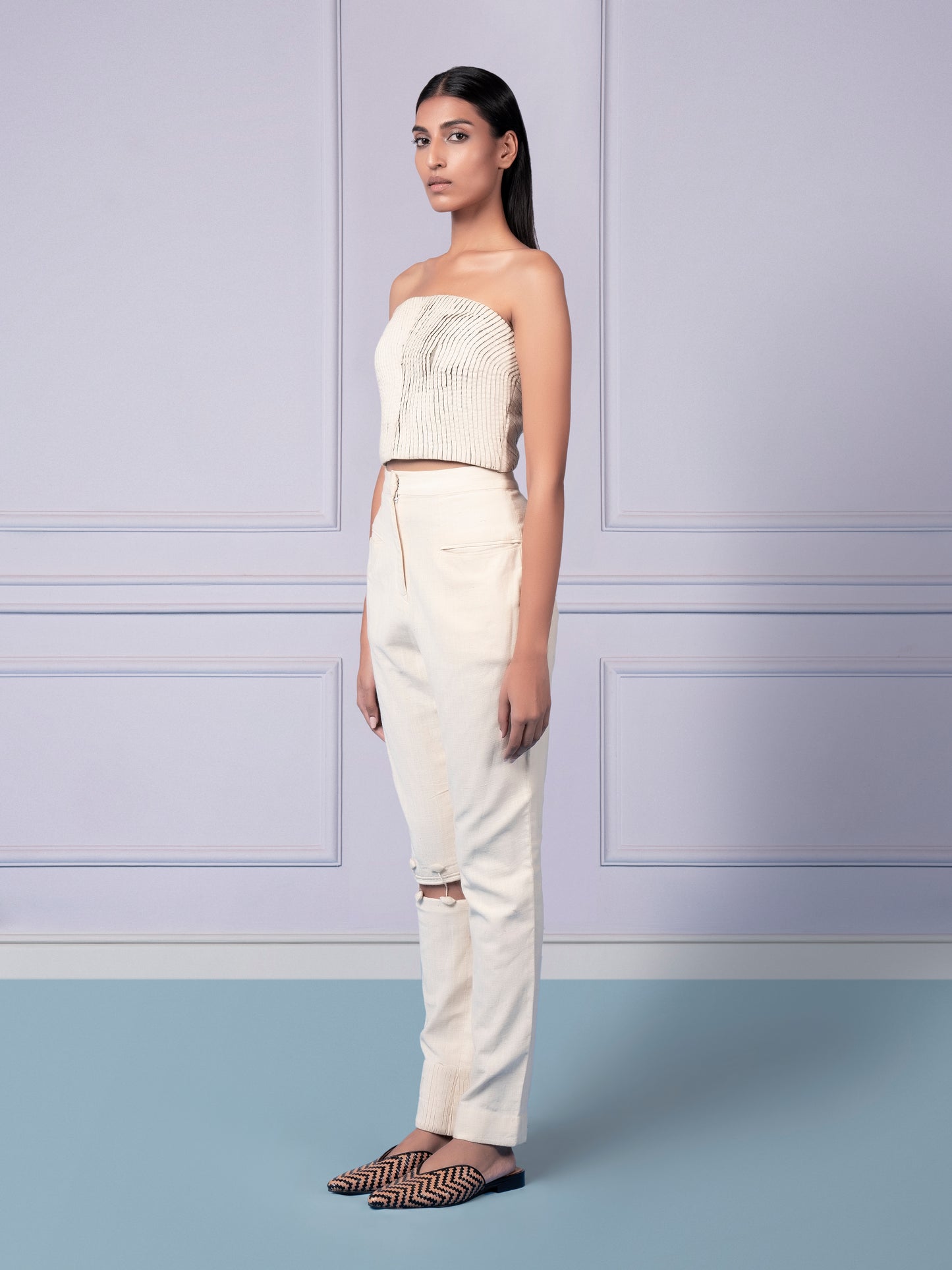 Stylish khaadi corset top with strake pattern and narrow pants with cutout knee detailing for modern fashion