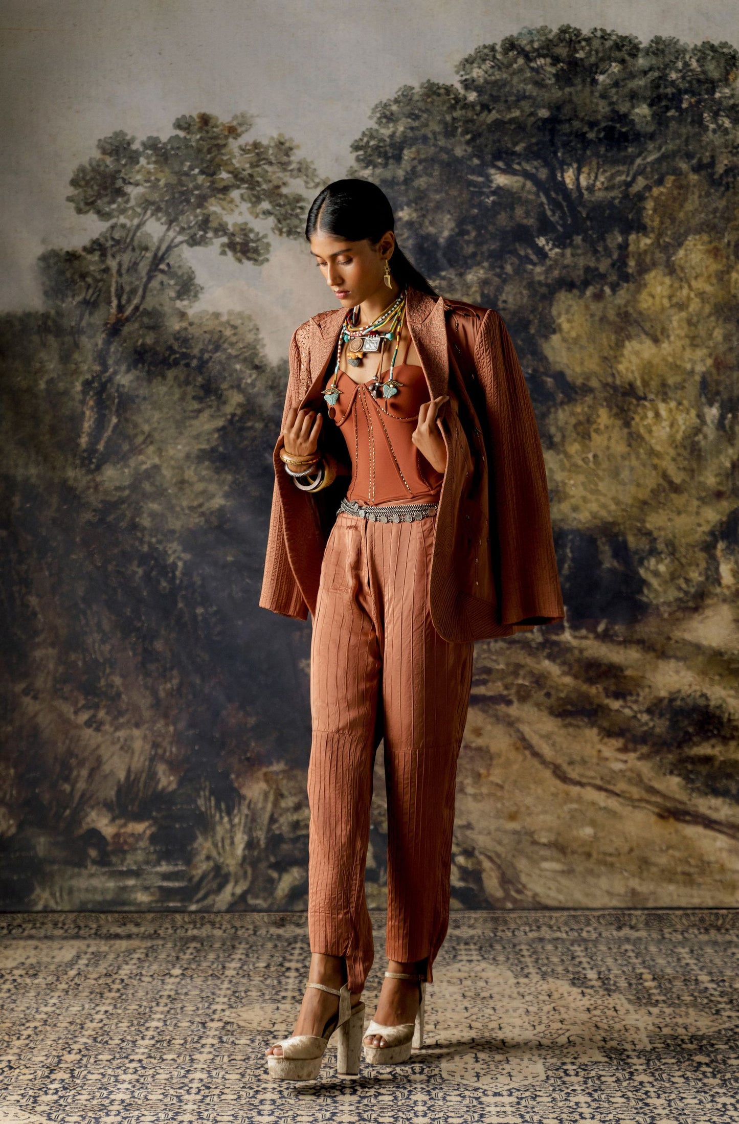 Full view of the Jaisalmer suit set for women showcasing the textured jacket and pintuck trousers