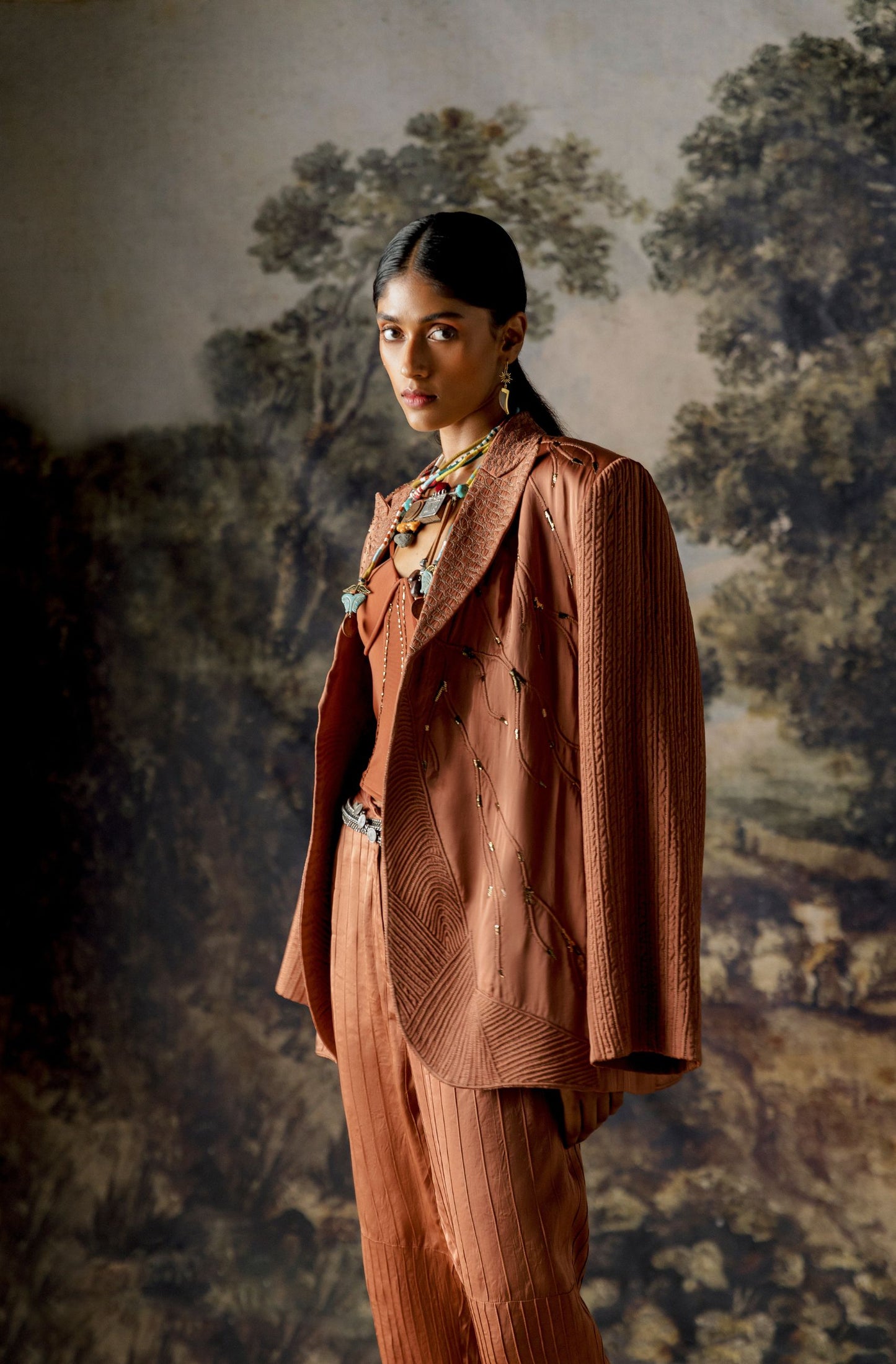 Side view of the Jaisalmer suit set highlighting the chic jacket style and tailored pintuck trousers