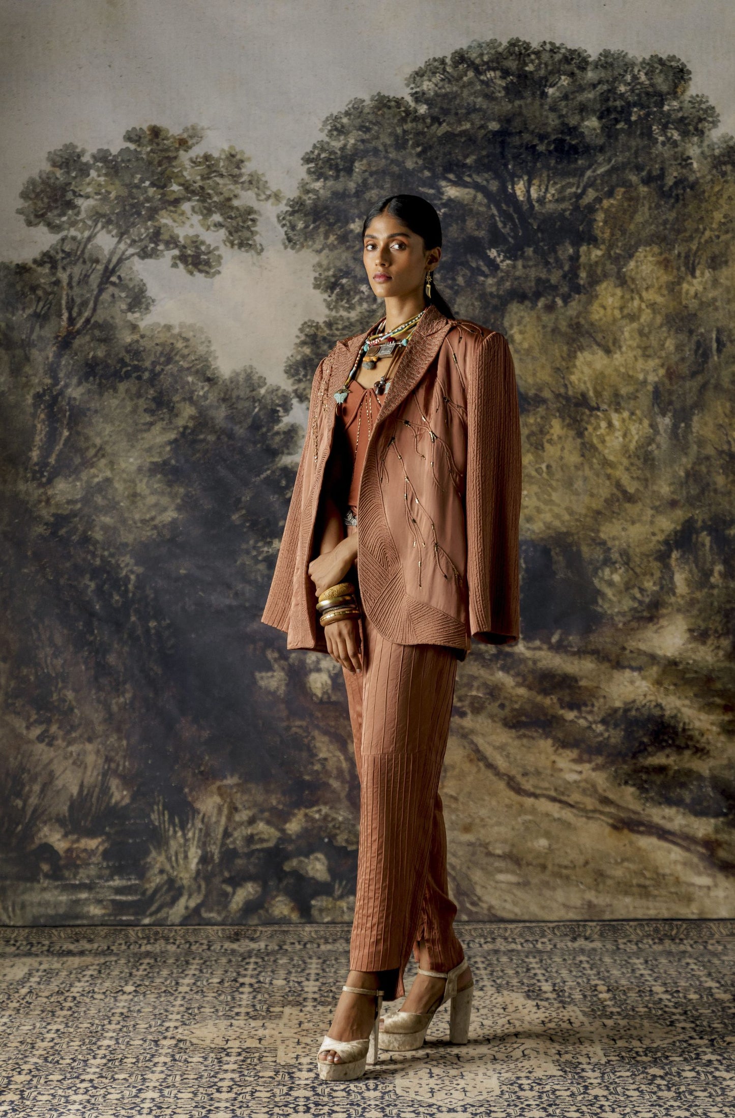 Jaisalmer suit set for women with textured jacket, embroidered corset, and pintuck trousers
