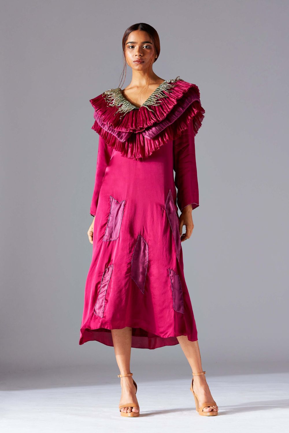 Stylish designer dress for women with layered ruching and metallic details, perfect for a modern and fashionable look