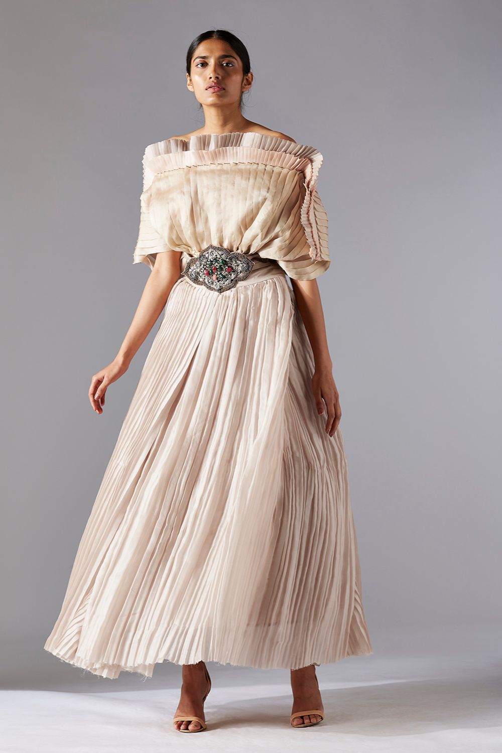 Avant-garde pleated mushroom top paired with a grandeur ballroom skirt, offering a unique and statement-making fashion look for women
