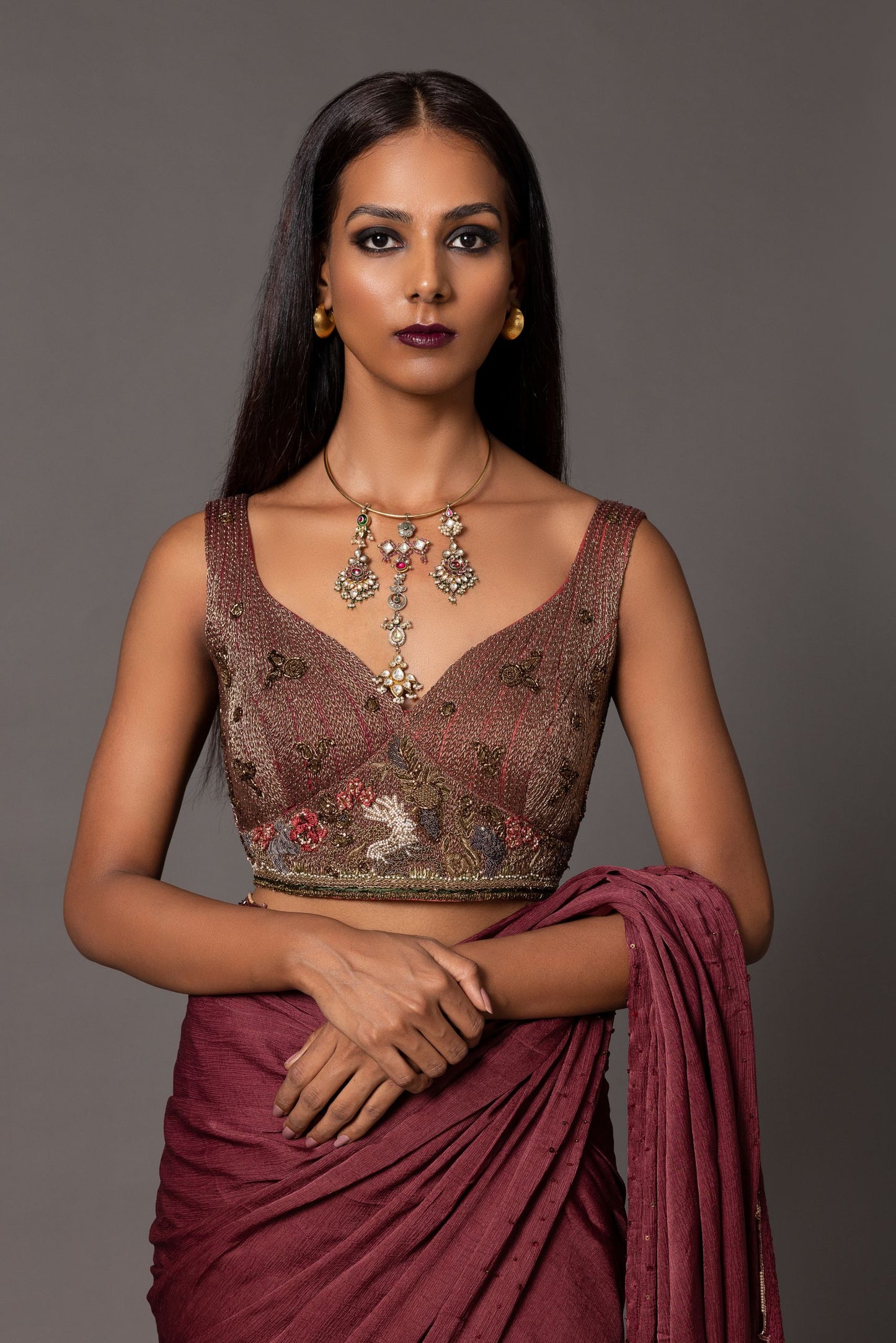 Heavy metallic blouse with contemporary embroidery, floral thread work, and animal motifs, available for purchase at A Humming Way