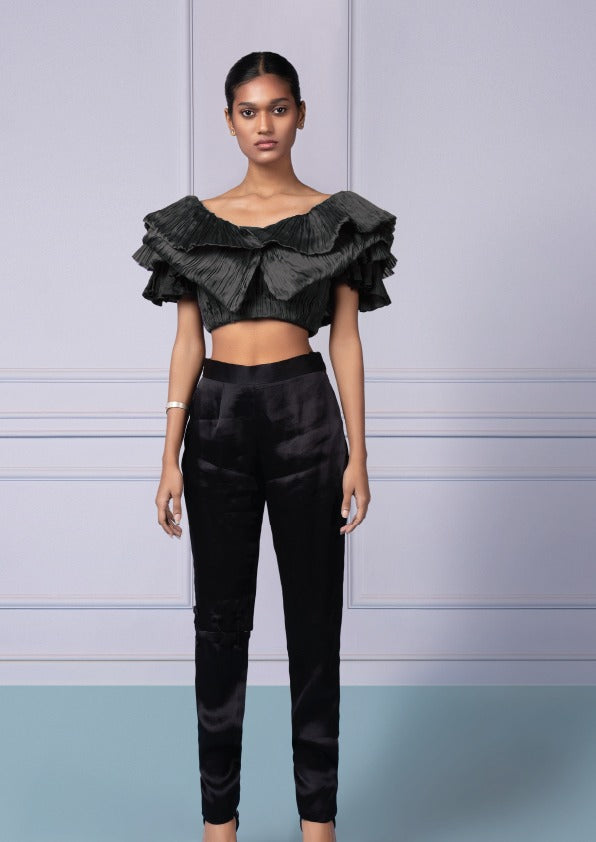 Fashionable Gill Fungi Top and Intemperate Pants set for women, featuring a ruched crop top and stylish pants with unique cut-out details for a chic look