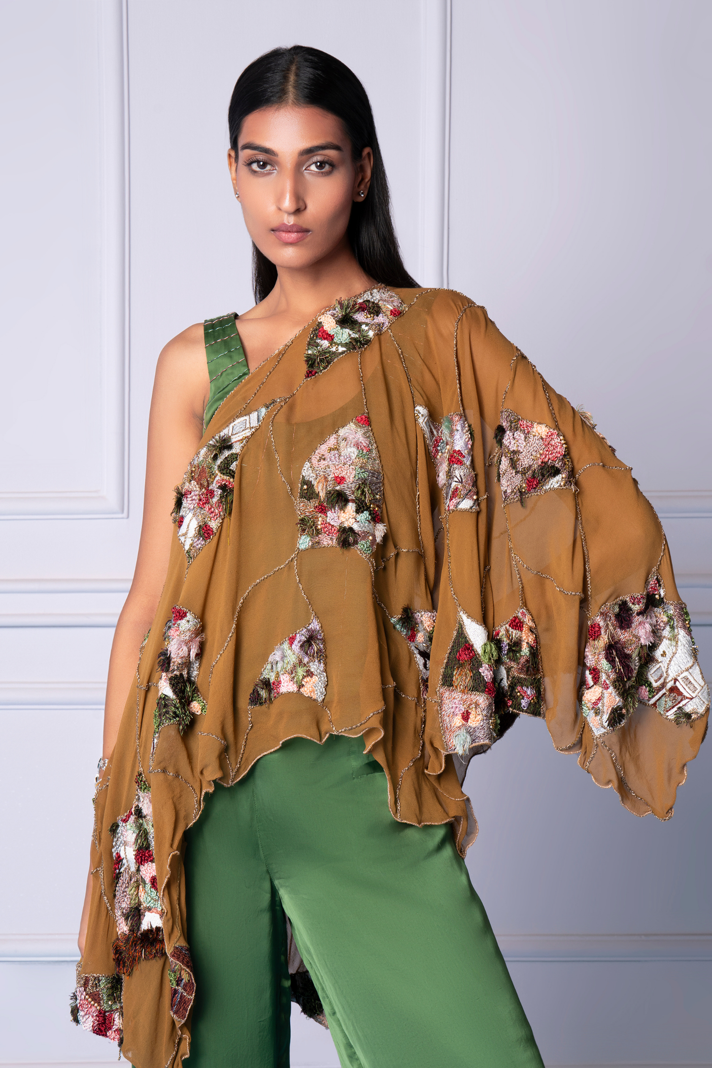 Focus on the corset detail and embroidered cape of the Topiary kaftan for women