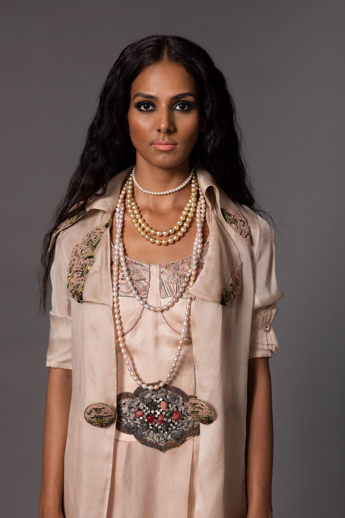 Close-up of Multi-Color Hand Embroidery on Roma Blush Corset Gown and Hour Grey Carpet Jacket