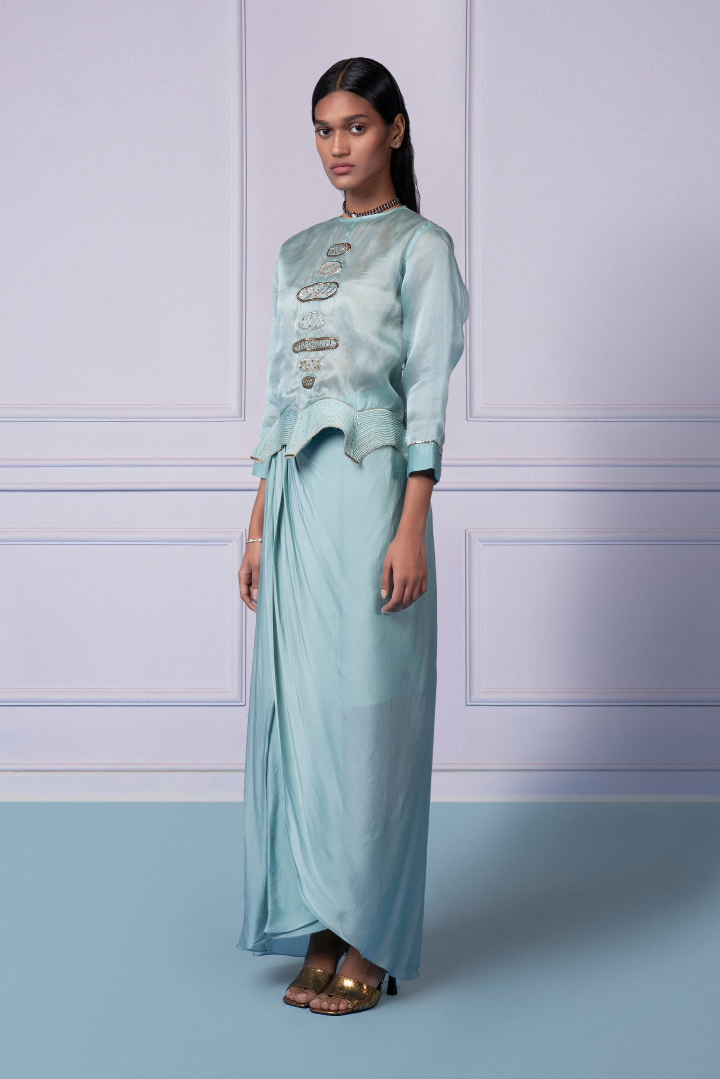 Side view of the Megh Set, emphasizing the sleek fit of the embroidered blouse and the elegant drape of the satin skirt