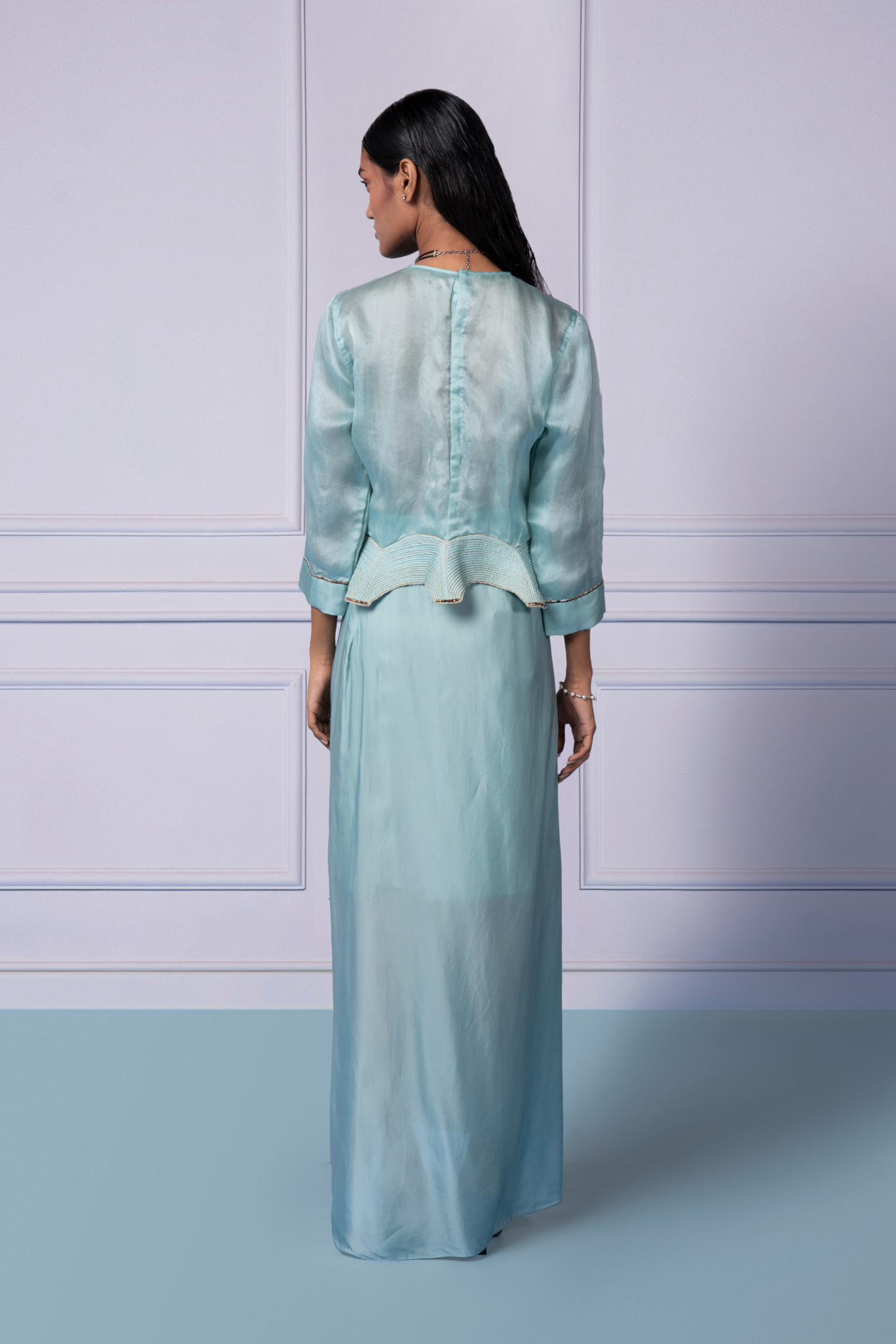 Back view of the Megh Set, showing the metallic embroidered blouse and the flattering draped satin skirt