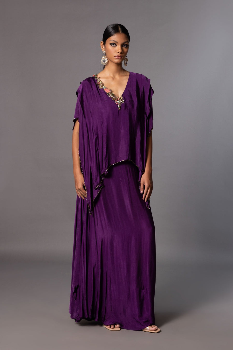 Iris Embroidered Kaftan Gown with draped sleeves, asymmetric neckline, and natural stones, pearls, and metal beads for an elegant look