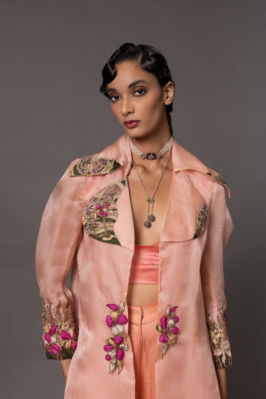 Close-up of the hand-embroidered lapels and 3D floral waist detailing on the Minakari Pink Carpet Embroidered Jacket